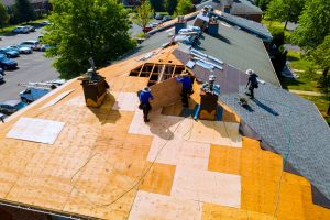 Replace old asphalt bitumen shingles on house roof in order to repair roof